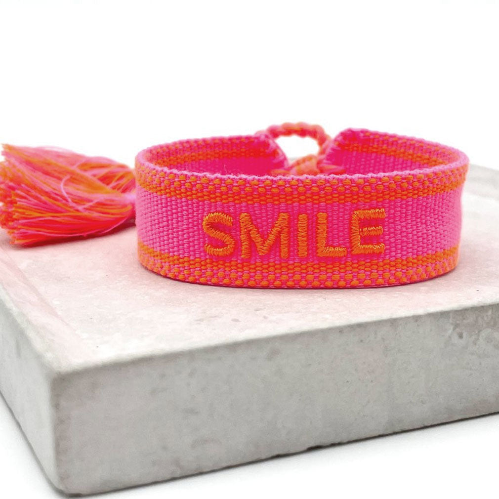 Canvas Smile Statement Armband Stoff Neon Pink Orange Quasten